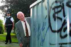 G&NM CSG Vice-Chairman Ian Wallace and Sergeant Andrew Verreydt inspect some grafitti in Westhill