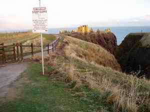 the coastal safety sign on the cliffs at Dunnottar